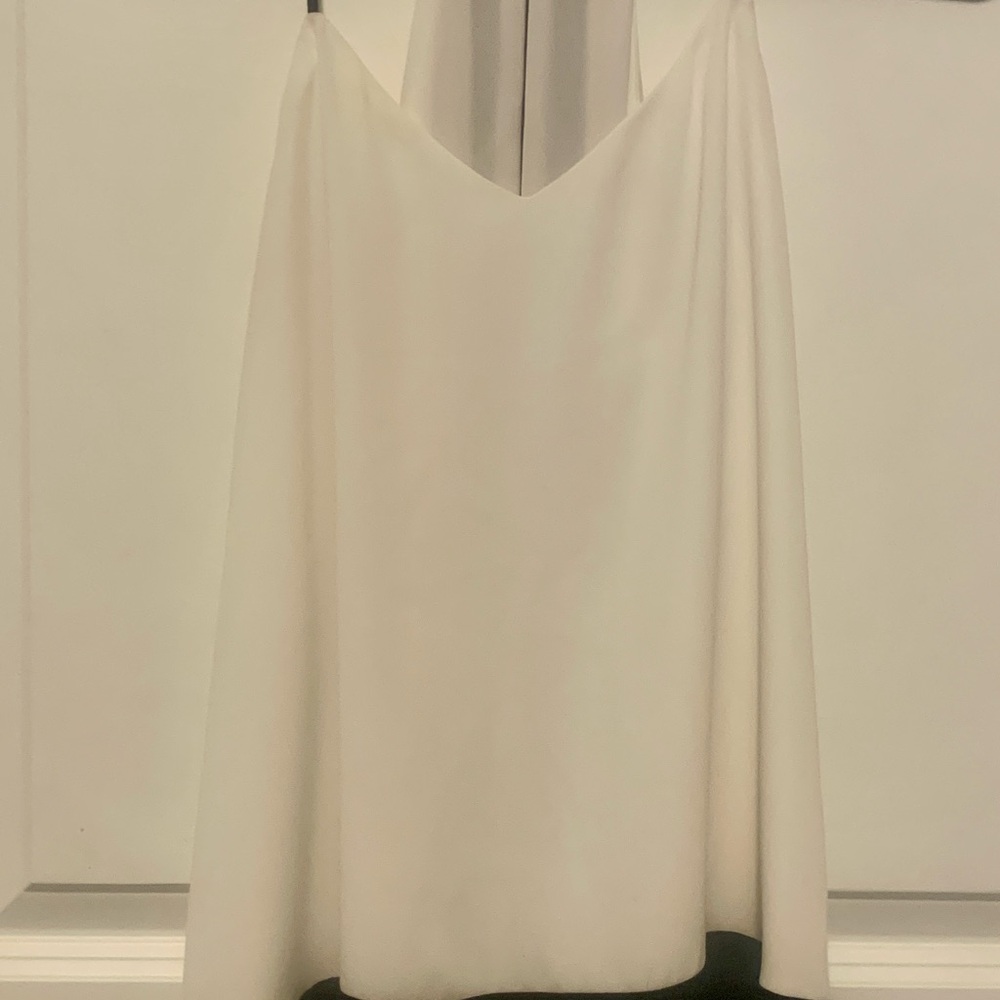 Elegant Black and White sleeveless blouse